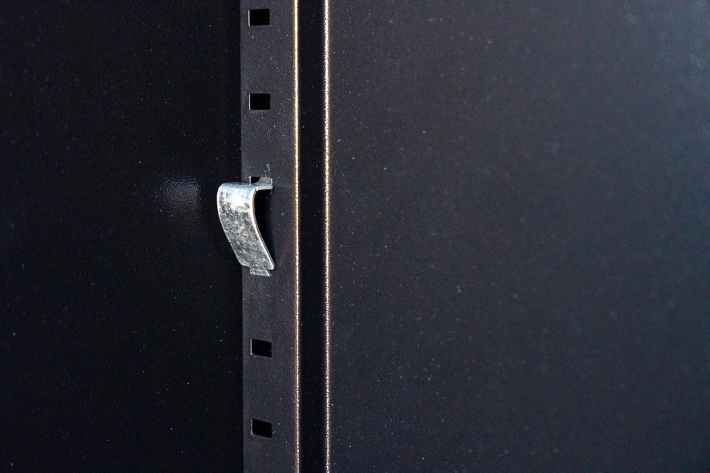 Finishing Touches - A shelf support fastened securely.