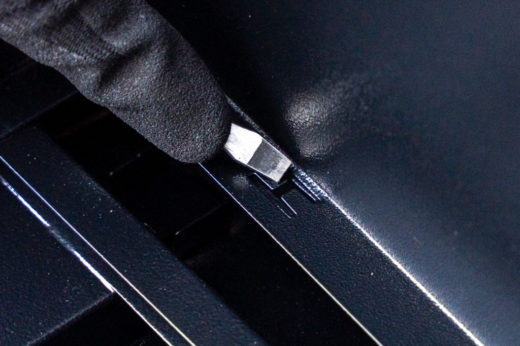 Building the Frame - Use a Flat-head screwdriver to bend the "H-Flaps" into the frame slots.