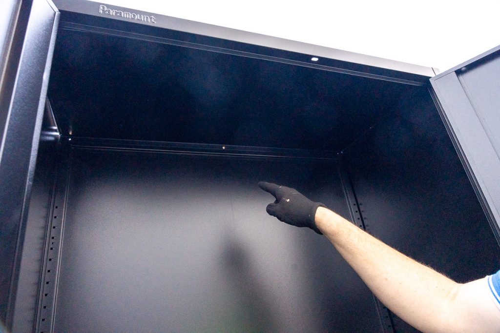 Building the Frame - Secure the top panel with a screw in the middle.